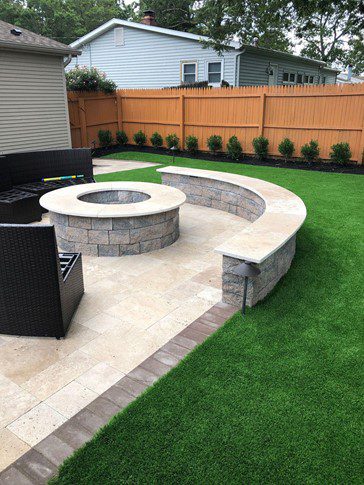 backyard artificial turf by fire pit
